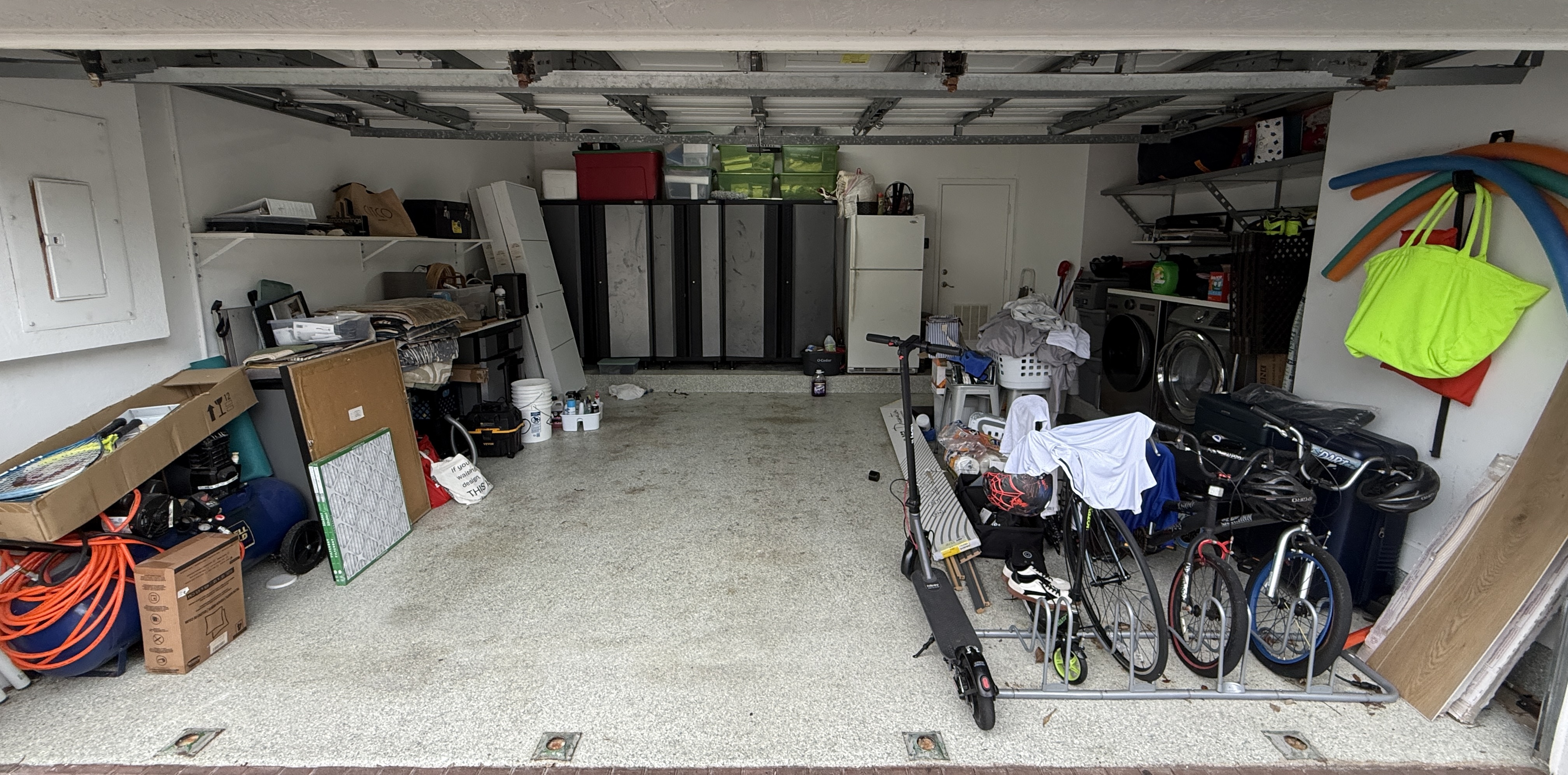 Cluttered garage before cleaning